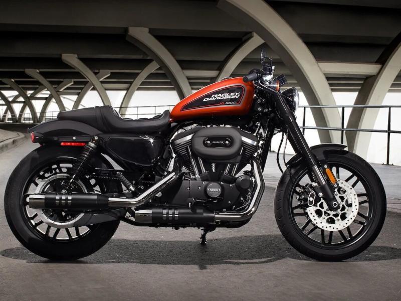 A black and orange Harley-Davidson® XL1200CX Sportster® Roadster™ in a parking garage